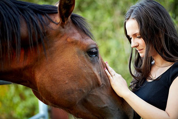teen working through problems with horses