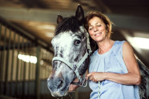 senior woman finding purpose and happiness with horses